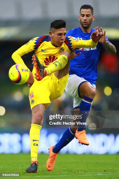 Edgar Mendez of Cruz Azul struggles for the ball with Edson Alvarez of America during the 13th round match between America and Cruz Azul as part of...