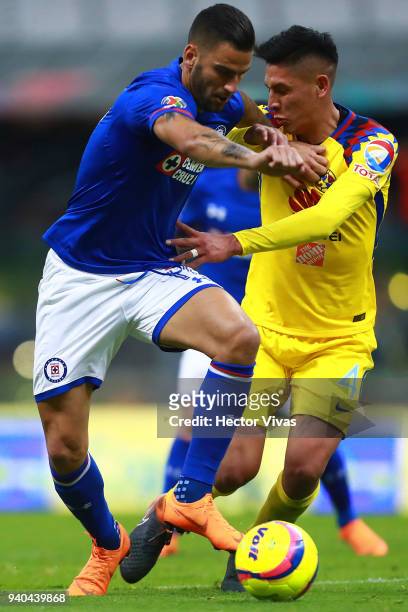 Edgar Mendez of Cruz Azul struggles for the ball with Edson Alvarez of America during the 13th round match between America and Cruz Azul as part of...