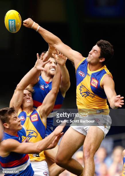 Tom Barrass of the Eagles and Marcus Bontempelli of the Bulldogs compete for the ball during the round two AFL match between the Western Bulldogs and...