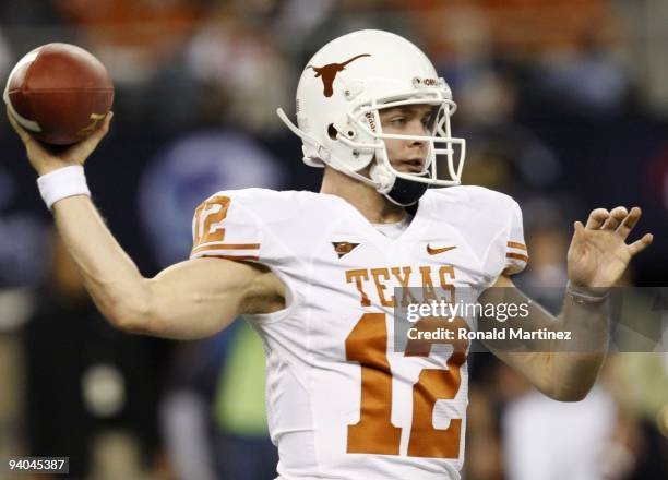 Quarterback Colt McCoy of the Texas Longhorns passes the ball against the Nebraska Cornhuskers at Cowboys Stadium on December 5, 2009 in Arlington,...