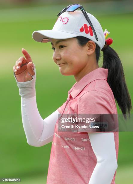 Japanese golfer Ayako Uehara acknowledges the crowd after birdying the ninth hole of the third round of the ANA Inspiration on March 31 in Rancho...