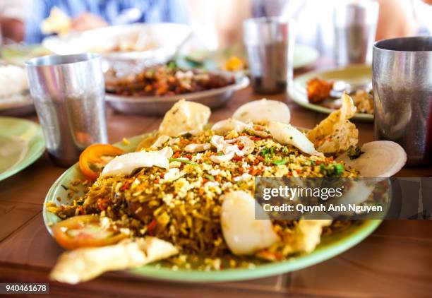 indian cuisine: plate of pilau fried rice on table - indian spices bildbanksfoton och bilder