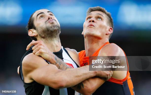 Darcy Moore of the Magpies and Rory Lobb of the Giants compete for the ball during the round two AFL match between the Collingwood Magpies and the...