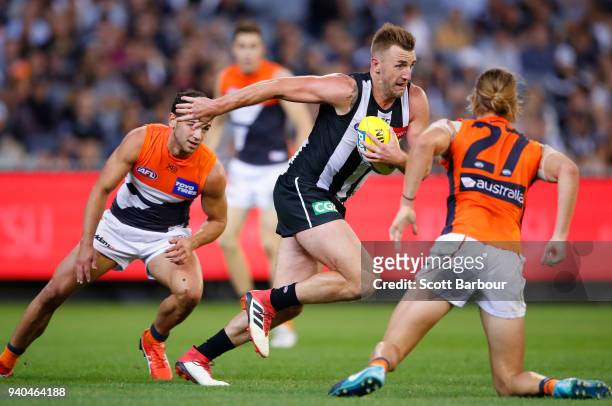 Lynden Dunn of the Magpies runs with the ball during the round two AFL match between the Collingwood Magpies and the Greater Western Sydney Giants at...