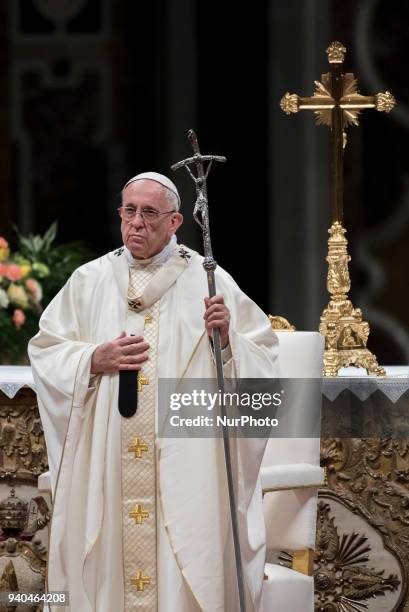 Pope Francis presides over a solemn Easter vigil ceremony in St. Peter's Basilica at the Vatican, Saturday, March 31, 2018.