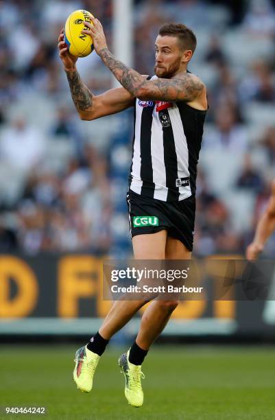 Jeremy Howe of the Magpies runs with the ball during the round two AFL match between the Collingwood Magpies and the Greater Western Sydney Giants at...