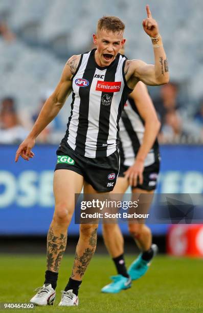 Ben Crocker of the Magpies celebrates after kicking a goal during the round two AFL match between the Collingwood Magpies and the Greater Western...