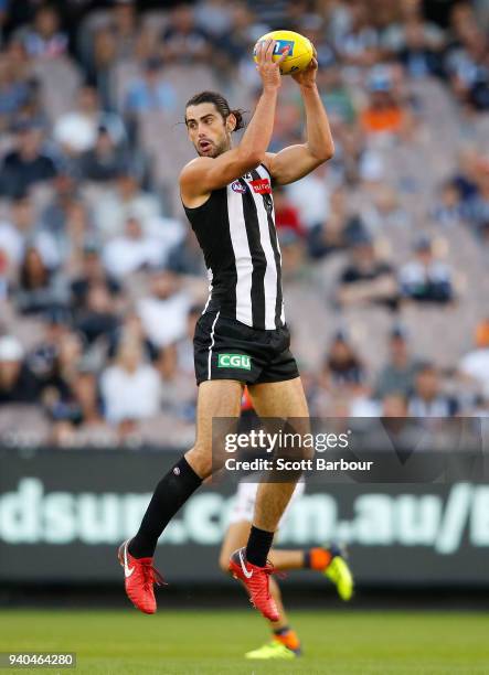 Brodie Grundy of the Magpies runs with the ball during the round two AFL match between the Collingwood Magpies and the Greater Western Sydney Giants...