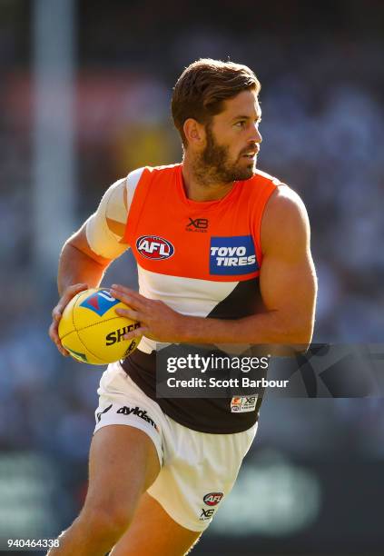 Callan Ward of the Giants runs with the ball during the round two AFL match between the Collingwood Magpies and the Greater Western Sydney Giants at...