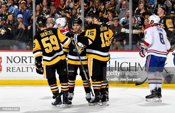 Riley Sheahan of the Pittsburgh Penguins celebrates his third period goal against the Montreal Canadiens at PPG Paints Arena on March 31, 2018 in...