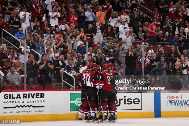 Luke Schenn, Christian Fischer, Oliver Ekman-Larsson, Dylan Strome and Max Domi of the Arizona Coyotes celebrate after Schenn scored a goal against...