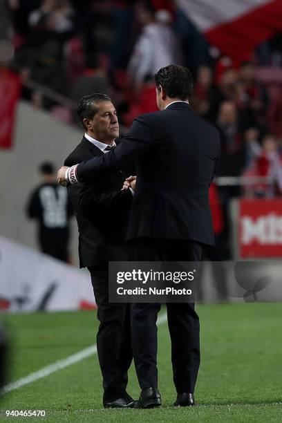 Guimaraes' head coach Jose Peseiro shakes hands with Benfica's head coach Rui Vitoria after the Portuguese League football match SL Benfica vs...