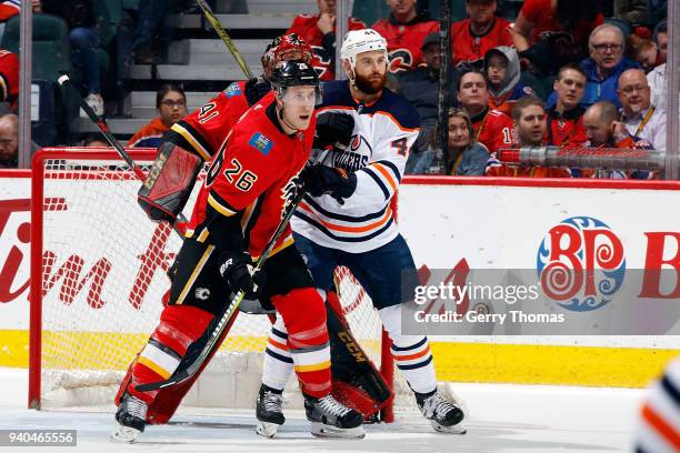 Michael Stone of the Calgary Flames skates against Zack Kassian of the Edmonton Oilers during an NHL game on March 31, 2018 at the Scotiabank...