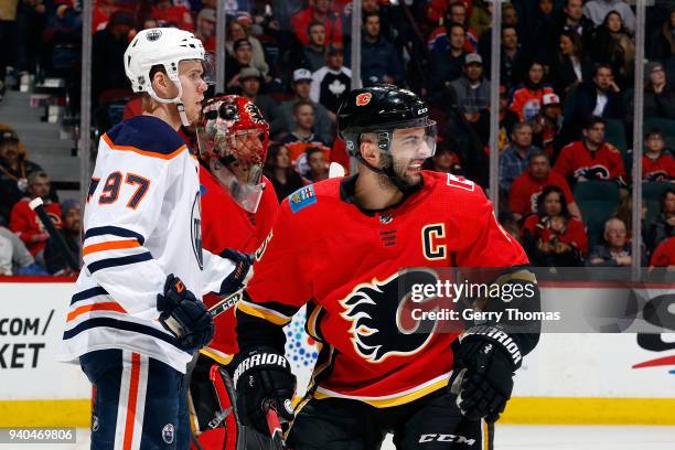 Mark Giordano of the Calgary Flames skates against Connor McDavid of the Edmonton Oilers during an NHL game on March 31, 2018 at the Scotiabank...