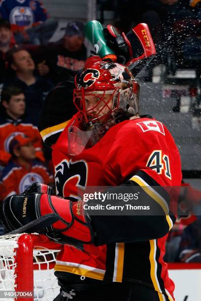 Mike Smith of the Calgary Flames gets a drink during an NHL game against the Edmonton Oilers on March 31, 2018 at the Scotiabank Saddledome in...