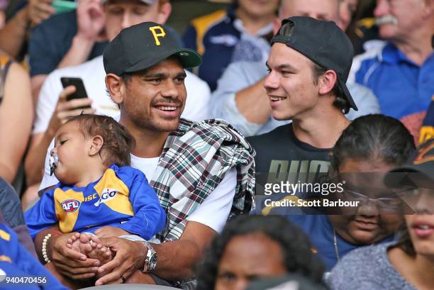 Cyril Rioli of the Hawks and Daniel Rioli of the Tigers watch the match from the crowd during the round two AFL match between the Western Bulldogs...