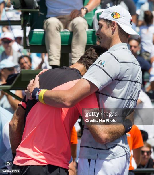 John Isner, from the USA, shake hands and hugs an exhausted Juan Martin Del Potro, from Argentina, after defeating him for the Miami Open semifinals...