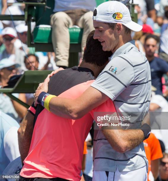 John Isner, from the USA, shake hands and hugs an exhausted Juan Martin Del Potro, from Argentina, after defeating him for the Miami Open semifinals...