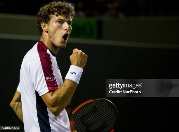 Pablo Carreno Busta, from Spain, reacts after winning a point against Alexander Zverev, from Germany, during his semi final match at the Miami Open...