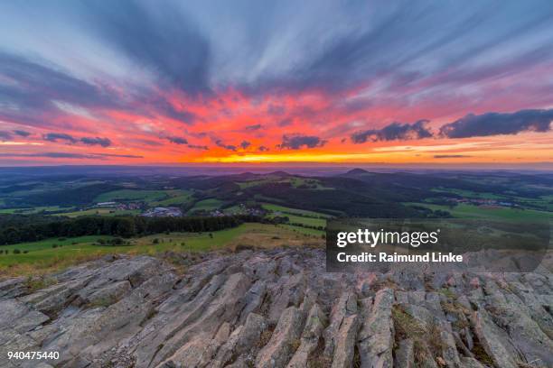 mountain landscape at sunset, abtsrodaer kuppe, wasserkuppe, poppenhausen, rhon mountain range, hesse, germany - rhön stock-fotos und bilder