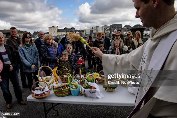 Priest blesses Easter baskets ahead of the Christian feast of Easter at The St Mary's Church, Claddagh on Saterday , March 31 in Galway, Ireland....