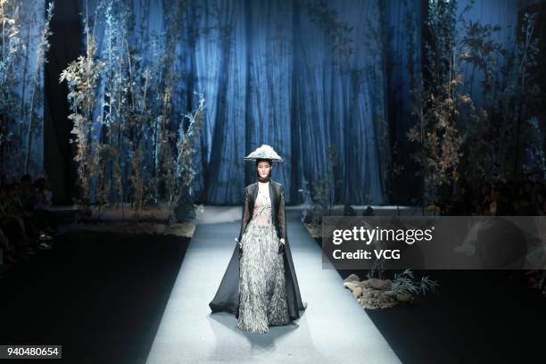 Model showcases designs on runway at Heaven Gaia show by designer Xiong Ying during the Mercedes-Benz China Fashion Week A/W 2018/2019 at Beijing...