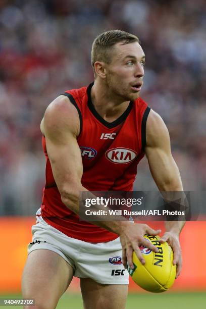 Brent Stanton of the Bombers looks to pass the ball during the round two AFL match between the Fremantle Dockers and the Essendon Bombers at Optus...