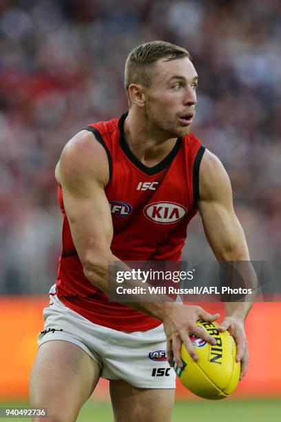 Brent Stanton of the Bombers looks to pass the ball during the round two AFL match between the Fremantle Dockers and the Essendon Bombers at Optus...