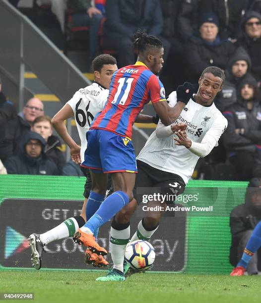 Joel Matip of Liverpool with Wilfried Zaha of Crystal Palace during the Premier League match between Crystal Palace and Liverpool at Selhurst Park on...