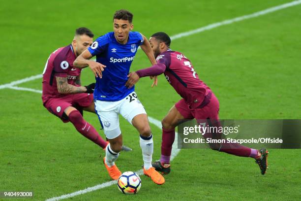 Dominic Calvert-Lewin of Everton battles with Raheem Sterling of Man City and Nicolas Otamendi of Man City during the Premier League match between...