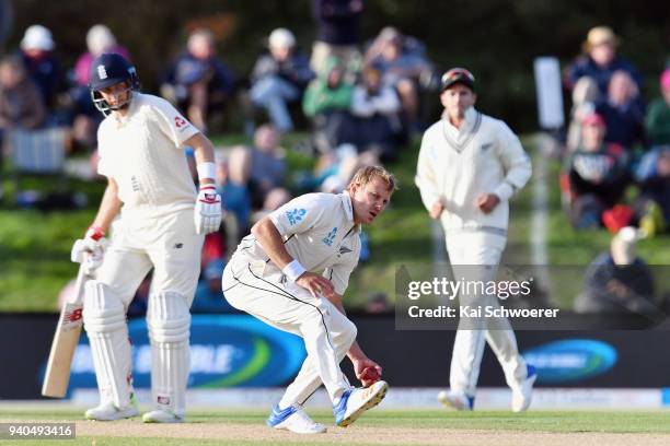 Neil Wagner of New Zealand fields the ball off his own bowling during day three of the Second Test match between New Zealand and England at Hagley...