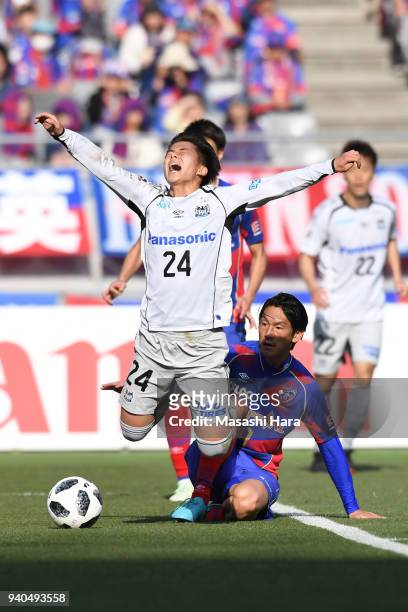 Yojiro Takahagi of FC Tokyo and Haruya Ide of Gamba Osaka compete for the ball during the J.League J1 match between FC Tokyo and Gamba Osaka at...