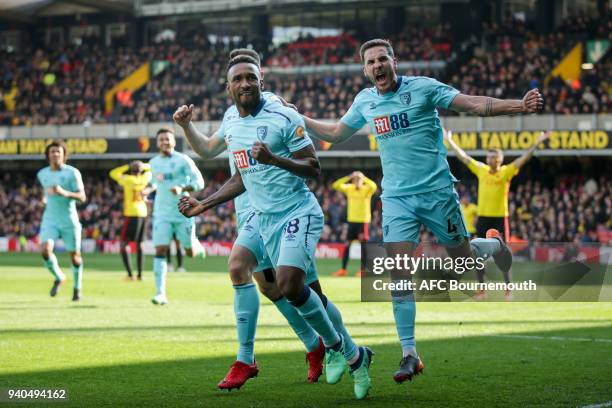Jermain Defoe of Bournemouth scores a goal to make it 2-2 and celebrates with Marc Pugh of Bournemouth and Dan Gosling of Bournemouth during the...