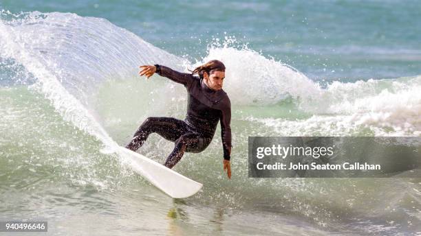 surfing in western sahara - wetsuit stock pictures, royalty-free photos & images