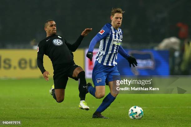 Arne Maier of Berlin battles for the ball with Jeffrey Bruma of Wolfsburg during the Bundesliga match between Hertha BSC and VFL Wolfsburg at...