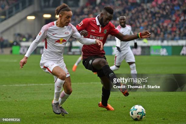 Yussuf Poulsen of Leipzig and Salif Sane of Hannover fight for the ball during the Bundesliga match between Hannover 96 and RB Leipzig at HDI-Arena...