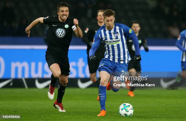 Mitchell Weiser of Berlin battles for the ball with Ignacio Camacho of Wolfsburg during the Bundesliga match between Hertha BSC and VFL Wolfsburg at...