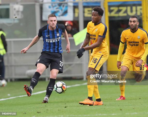 Milan Skriniar of Inter competes for the ball with Rolando Aarons during the serie A match between FC Internazionale and Hellas Verona FC at Stadio...