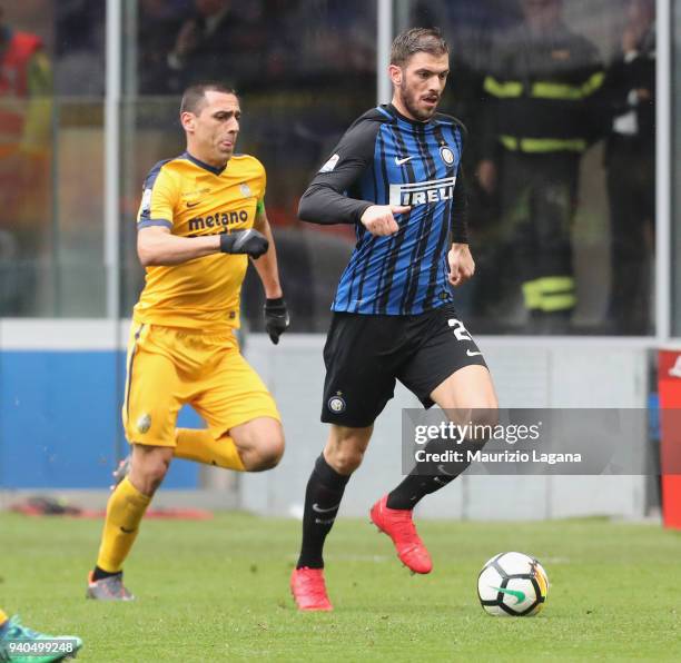Davide Santon of Inter competes for the ball with Romulo during the serie A match between FC Internazionale and Hellas Verona FC at Stadio Giuseppe...