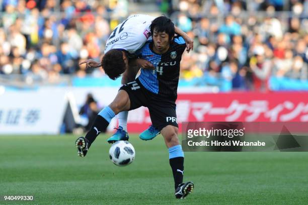 Sho Inagaki of Sanfrecce Hiroshima and Kengo Nakamura of Kawasaki Frontale compete for the ball during the J.League J1 match between Kawasaki...