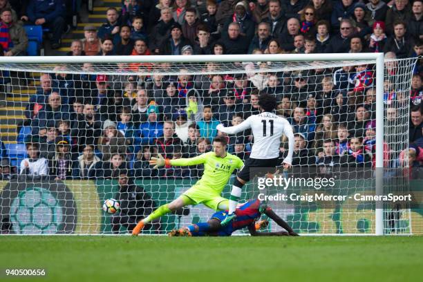 Liverpool's Mohamed Salah scores his side's second goal past Crystal Palace's Wayne Hennessey during the Premier League match between Crystal Palace...