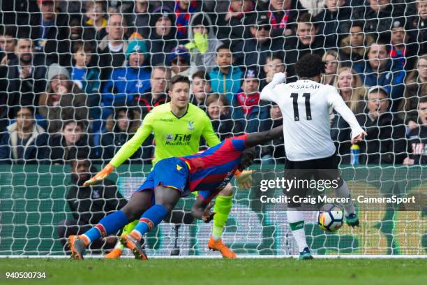 Liverpool's Mohamed Salah scores his side's second goal past Crystal Palace's Wayne Hennessey during the Premier League match between Crystal Palace...