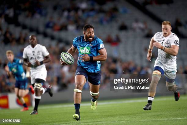 Patrick Tuipulotu of the Blues runs in to score a try during the round sevens Super Rugby match between the Blues and the Sharks at Eden park on...