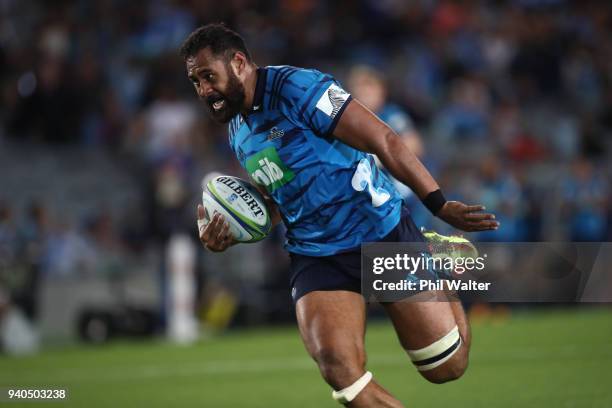 Patrick Tuipulotu of the Blues runs in to score a try during the round sevens Super Rugby match between the Blues and the Sharks at Eden park on...