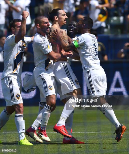 Chris Pontius, Perry Kitchen, Ema Boateng and Ashley Cole celebrate after a goal by Zlatan Ibrahimovic of Los Angeles Galaxy in the second half of...