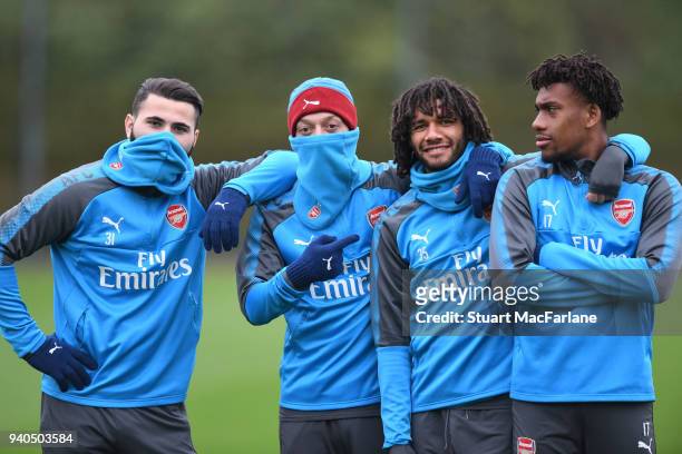 Sead Kolasinac, Mesut Ozil, Mo Elneny and alex Iwobi of Arsenal during a training session at London Colney on March 31, 2018 in St Albans, England.