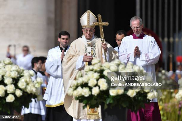 Pope Francis celebrates the mass of Easter on April 1, 2018 at St Peter's square in Vatican. - Christians around the world are marking the Holy Week,...