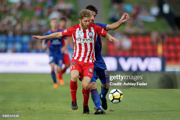 Ivan Vujica of the Jets contests the ball against Luke Brattan of Melbourne City during the round 25 A-League match between the Newcastle Jets and...