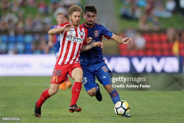 Ivan Vujica of the Jets contests the ball against Luke Brattan of Melbourne City during the round 25 A-League match between the Newcastle Jets and...