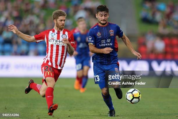 Ivan Vujica of the Jets contests the ball against Luke Brattan of Melbourne City during the round 25 A-League match between the Newcastle Jets and...